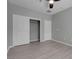 Cozy bedroom with bi-fold closet doors, closet with wire racks, and ample natural light for comfort at 2144 Mountain City St, Henderson, NV 89052