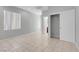 Spacious bedroom featuring tile flooring, large window, closet and neutral paint at 2144 Mountain City St, Henderson, NV 89052