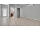 Bright bedroom featuring tile flooring, ensuite bathroom, closet and a large glass door at 2144 Mountain City St, Henderson, NV 89052