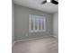 Inviting bedroom with sleek flooring and natural light from shuttered windows, offering a bright space at 2144 Mountain City St, Henderson, NV 89052