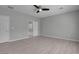 Neutral bedroom with sleek flooring and a ceiling fan shows an ensuite bathroom with tub at 2144 Mountain City St, Henderson, NV 89052