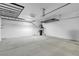 Spacious garage featuring high ceilings, overhead storage racks, and ample room for vehicles at 2144 Mountain City St, Henderson, NV 89052