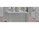 Bright kitchen featuring white cabinets, modern appliances, and a counter with marble countertops at 2144 Mountain City St, Henderson, NV 89052
