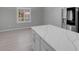 Kitchen island with quartz countertop and view of backyard at 2144 Mountain City St, Henderson, NV 89052
