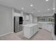 Spacious kitchen with white cabinets, modern appliances, and large kitchen island at 2144 Mountain City St, Henderson, NV 89052