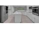 Bright kitchen with a large island, marble countertops, and stainless steel appliances at 2144 Mountain City St, Henderson, NV 89052