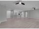 Open-concept living space featuring wood floors, neutral paint, and white trim at 2144 Mountain City St, Henderson, NV 89052
