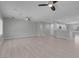 Open-concept living space featuring wood floors, neutral paint, ceiling fans, and recessed lighting at 2144 Mountain City St, Henderson, NV 89052