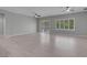Spacious living room with wood floors, neutral paint, and two ceiling fans at 2144 Mountain City St, Henderson, NV 89052