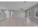 Open-concept living space with wood floors, neutral paint, and sliding glass doors at 2144 Mountain City St, Henderson, NV 89052