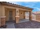 View of the covered patio with stone pillars and brick flooring at 2144 Mountain City St, Henderson, NV 89052