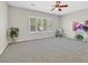 Bright bedroom with large window and ceiling fan at 2292 Saxtons River Rd, Henderson, NV 89044