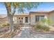 Inviting single-story home with a covered porch, low-maintenance landscaping, and a tile roof at 2292 Saxtons River Rd, Henderson, NV 89044