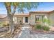 Inviting single-story home with a covered porch, low-maintenance landscaping, and a tile roof at 2292 Saxtons River Rd, Henderson, NV 89044