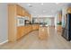 Spacious kitchen with tile floors, island, and stainless steel appliances at 2292 Saxtons River Rd, Henderson, NV 89044
