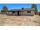 Spacious backyard featuring a covered patio and potential for landscaping, perfect for outdoor living at 2315 Lincoln Rd, Las Vegas, NV 89115