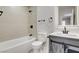 This renovated bathroom has updated vanity, mirror, and tiling around the bathtub and shower at 2315 Lincoln Rd, Las Vegas, NV 89115