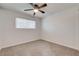 Carpeted bedroom with window and ceiling fan at 2315 Lincoln Rd, Las Vegas, NV 89115