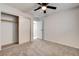 This bedroom features neutral carpet and a ceiling fan, offering a cozy and comfortable space at 2315 Lincoln Rd, Las Vegas, NV 89115