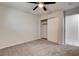 This carpeted bedroom features an access door and closet with sliding doors at 2315 Lincoln Rd, Las Vegas, NV 89115