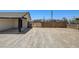 View of the carport and exterior of home with desert landscaping and fencing at 2315 Lincoln Rd, Las Vegas, NV 89115