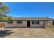 Ranch-style home with a neutral color palette, large windows and a spacious front yard at 2315 Lincoln Rd, Las Vegas, NV 89115
