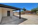 Exterior shot of carport, desert landscaping, fencing, and exterior door at 2315 Lincoln Rd, Las Vegas, NV 89115
