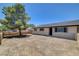 Ranch-style home featuring a spacious front yard with a large tree, and neutral paint color at 2315 Lincoln Rd, Las Vegas, NV 89115