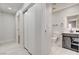 This hallway features modern floors, access to bedrooms, and an adjacent bathroom with contemporary fixtures at 2315 Lincoln Rd, Las Vegas, NV 89115