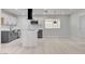 Modern kitchen featuring white cabinets, stainless steel appliances, and a large island with marble countertop at 2315 Lincoln Rd, Las Vegas, NV 89115