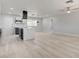 Open-concept living space showcasing sleek floors, modern kitchen with island, and fresh, bright interior at 2315 Lincoln Rd, Las Vegas, NV 89115