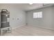 This utility room is equipped with a water heater, laminate floors, and a window for natural light at 2315 Lincoln Rd, Las Vegas, NV 89115