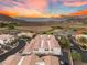 Scenic aerial view of townhouses featuring red tiled roofs, mountain and lake views at 251 Big Horn Dr, Boulder City, NV 89005