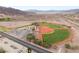 Community baseball fields with parking lot in an aerial view showcasing recreational area at 251 Big Horn Dr, Boulder City, NV 89005