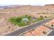 Aerial view of community amenities including playground, tennis courts, and walking paths at 251 Big Horn Dr, Boulder City, NV 89005