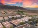 Wide aerial view of residential area showing red-tiled roofs and mountain backdrop at 251 Big Horn Dr, Boulder City, NV 89005