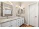 Bathroom featuring double sinks, modern fixtures, and a glass-enclosed shower at 251 Big Horn Dr, Boulder City, NV 89005