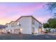 Two-story townhome featuring an attached garage and well-lit entry at 251 Big Horn Dr, Boulder City, NV 89005