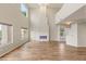 Spacious living room features a modern fireplace, high ceilings, and multiple large windows at 251 Big Horn Dr, Boulder City, NV 89005