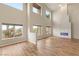 Bright living room with high ceilings, contemporary fireplace, and hardwood floors at 251 Big Horn Dr, Boulder City, NV 89005