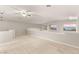 Spacious loft area with carpeted flooring, a ceiling fan, and scenic views from multiple windows at 251 Big Horn Dr, Boulder City, NV 89005