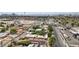 A neighborhood aerial view displaying the home and surrounding properties with skyline in the background at 2528 Sunrise Ave, Las Vegas, NV 89101