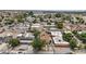 An aerial view of a property with solar panels, surrounded by neighboring houses and trees in a neighborhood setting at 2528 Sunrise Ave, Las Vegas, NV 89101