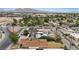 Aerial view of a residential home's backyard and solar panels, with mountains visible in the background at 2528 Sunrise Ave, Las Vegas, NV 89101