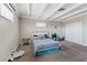 Cozy bedroom with carpet floors, beam ceiling, and ample natural light creates a relaxing retreat at 2528 Sunrise Ave, Las Vegas, NV 89101
