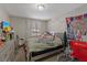 Cozy bedroom with neutral decor, large window, and comfortable bed at 2528 Sunrise Ave, Las Vegas, NV 89101