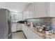Modern kitchen with stainless steel appliances, granite countertops, and tile backsplash at 2528 Sunrise Ave, Las Vegas, NV 89101