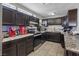 Kitchen showcases black cabinets, granite counters, stainless steel appliances, and ample storage at 2528 Sunrise Ave, Las Vegas, NV 89101