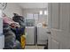 Functional laundry room with a washer, dryer, and a window, perfect for chores at 2528 Sunrise Ave, Las Vegas, NV 89101