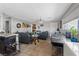 Comfortable living room features tile floors, ceiling fan and lots of natural light at 2528 Sunrise Ave, Las Vegas, NV 89101